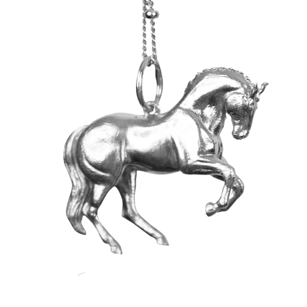An exquisite silver horse pendant on a slender chain, emphasizing its detailed artistry and elegant appearance.
The pendant is shaped like a  wild horse in mid-stride, with detailed features such as its mane and tail. The necklace chain is also silver and has a series of small, rounded beads interspersed along its length. Perfect for horse lovers, fans of equestrian inspired jewelry, horseback riders, silver horses  jewelry.