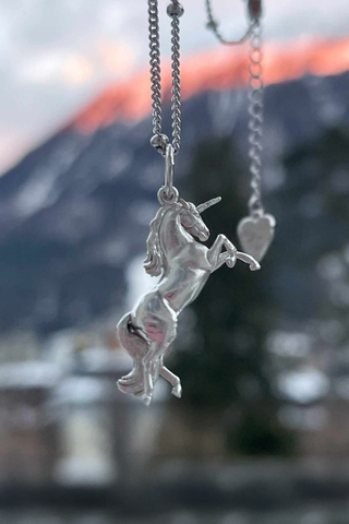 A beautifully crafted silver plated unicorn charm, symbolizing magic and grace with its radiant shine, with details on its horn, hair and tail. It’s perfect for unicorn lovers, equestrian jewelry fans, or anyone looking for a unique and meaningful gift. Complete with an elegant chain, it’s a celebration of whimsy and self-expression you can wear every day! The perfect unicorn inspired gifts and perfect silver gift.