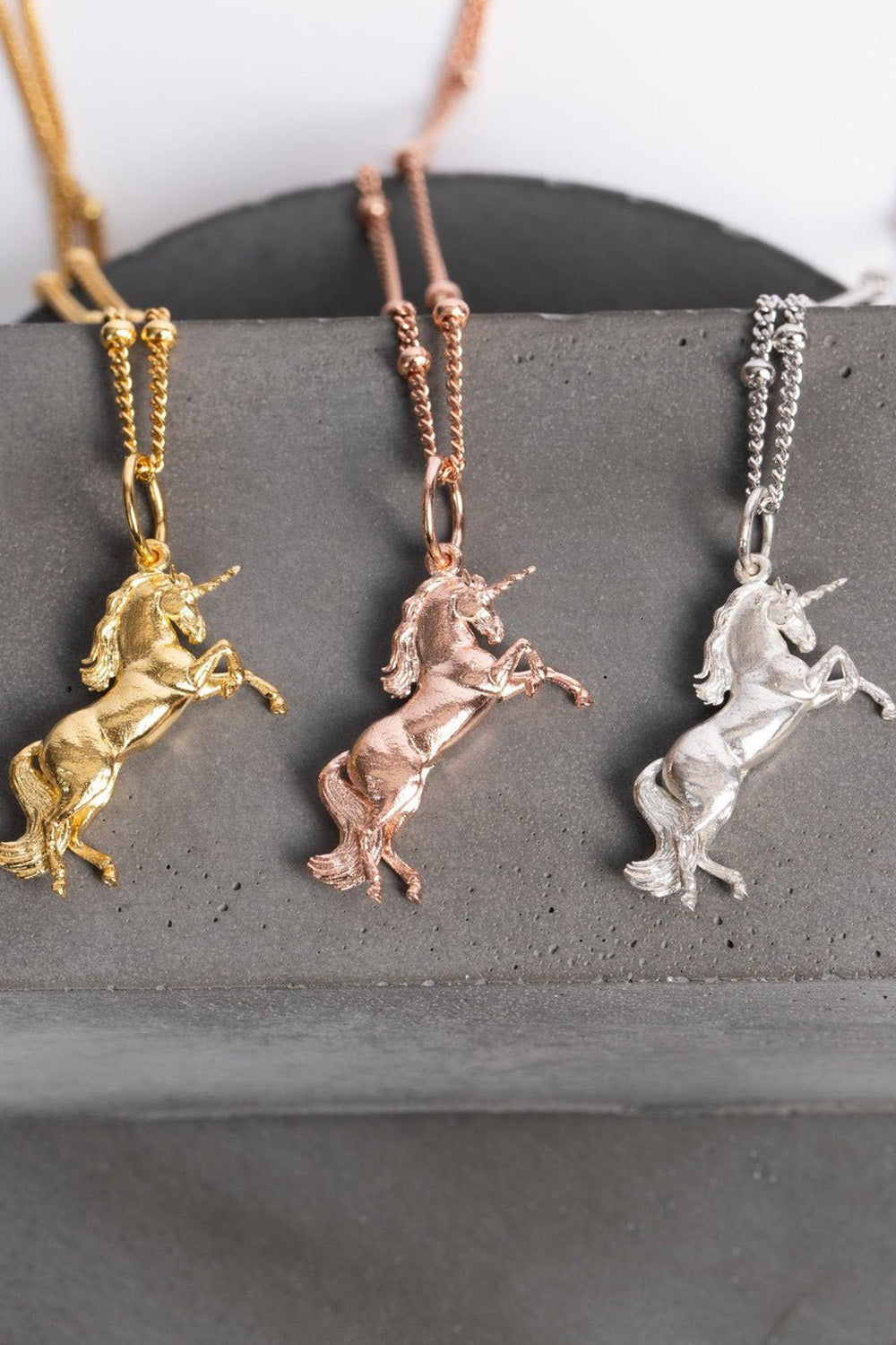 Three beautifully crafted silver plated , gold and roseunicorn charms, symbolizing magic and grace with its radiant shine, with details on its horn, hair and tail. It’s perfect for unicorn lovers, equestrian jewelry fans, or anyone looking for a unique and meaningful gift. Complete with an elegant chain, it’s a celebration of whimsy and self-expression you can wear every day! The perfect unicorn inspired gifts.