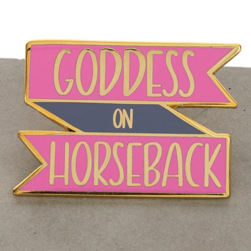 A goddess on horseback enamel pin in pink and touch of  purple, inscribed with Goddess on Horsesback, perfect for horse lovers , collectors, horse girls, horse riders, show jumping, horseback riders and more. This pin design  is a cool equestrian gifts. A piece that encourages and empowers our women in the equestrian life. Our pin design is a cool equestrian gifts, for young horse riders  and  Pink lovers.