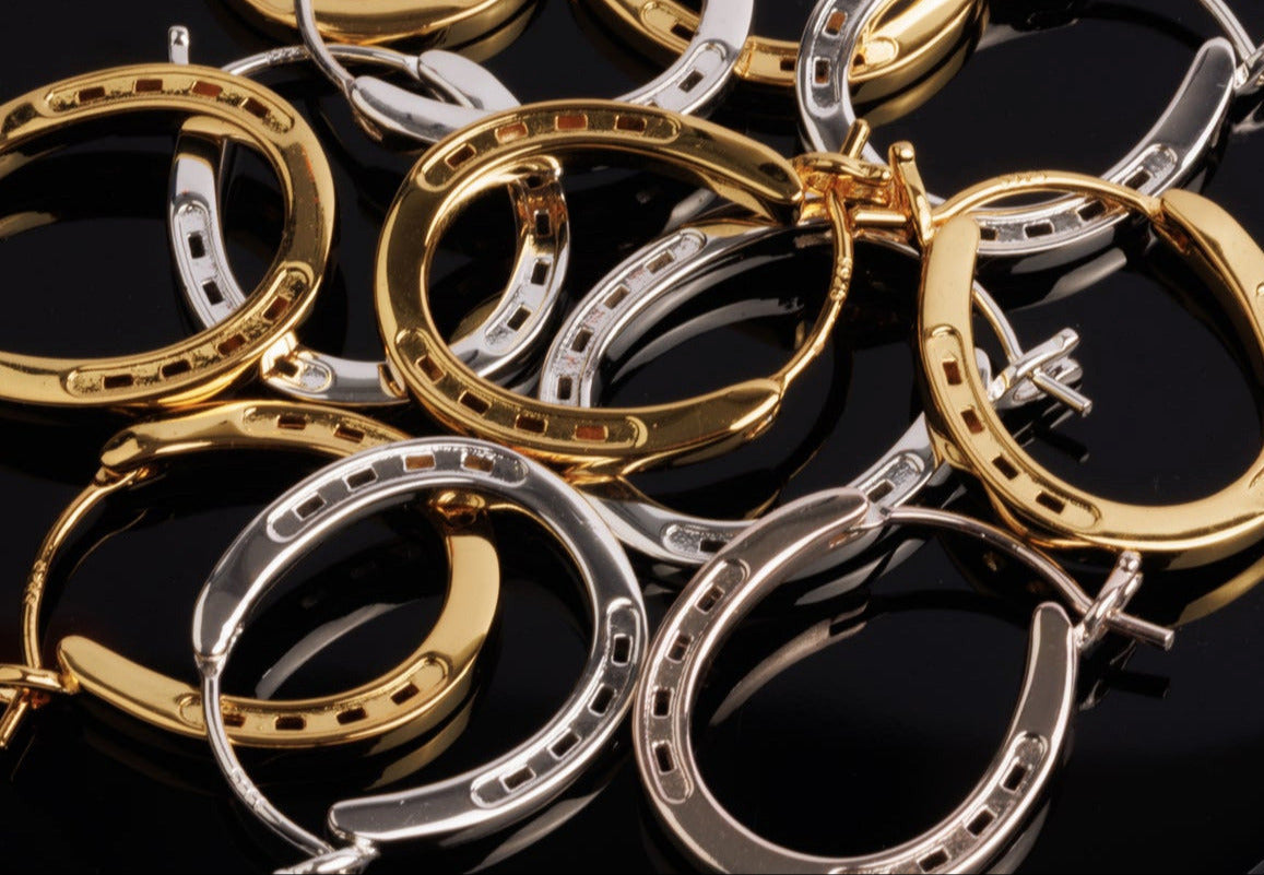 Our elegant silver and gold  hoop horseshoe earrings, emphasizing their gleaming finish and stylish form.
Our Silver Horse Shoe Earrings are unique equestrian gifts crafted from high-quality gold. This silver horseshoe earrings are the perfect equestrian lifestyle fan gift and a good luck charm. Our Horseshoe earrings are the perfect birthday present for horse lovers, horse girls, cowgirls. A representation of good luck.