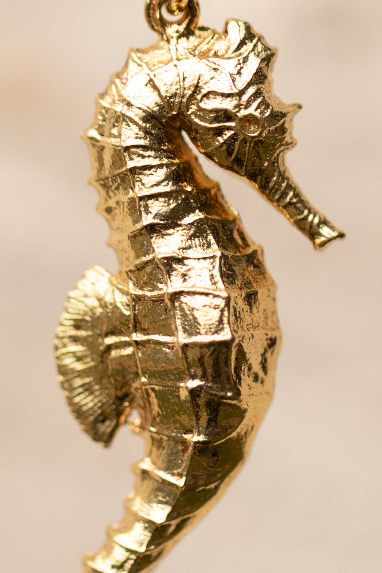 Our perfect seahorse pendant. a gold seahorse pendant elegantly displayed, showcasing its intricate design and craftsmanship. The pendant is shaped like a seahorse in mid-stride, with detailed features such as its tail and fins.  Perfect for seahorse lovers, ocean inspired jewelry,  gold seahorse jewelry, unique  gifts for   girls. 